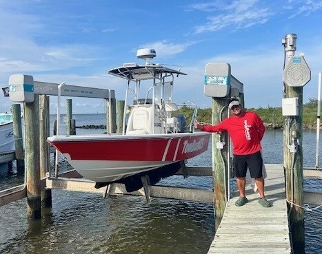 One of two, red response vessels and towing captain at TowBoatUS Lafitte, ready to help boaters get home 24/7 after a breakdown.